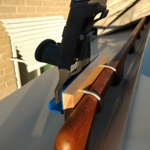 U-bolts around the handrails. I was going to bolt the gutter brackets right to the side of the top but decided I really didn't want to do that. This was plan B.