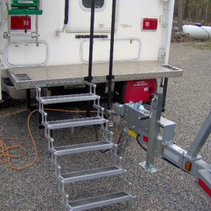 Northern Lite, Much smaller and lighter. But was next to impossible to get into it pulling the boat.