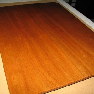 Board made utilizing some scraps to fill the hole from the Wallas (removed and sold).  Just some scrap 1/8" ply epoxied together to make 1/4", then cut out, some cleats stuck to the bottom side, and then varnished.