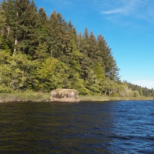 The shoreline often had large bolders at the edge, but the bottom was generally smooth sandy mud.
