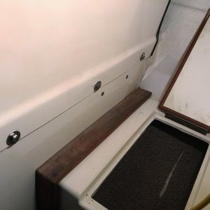 The Smart pump is held by 4 screws thru the bulkhead. 2 at the bottom of the bulkhead just above the foot compartment door, the other two below the door.