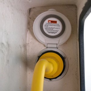 Shore power connection under port gunnel