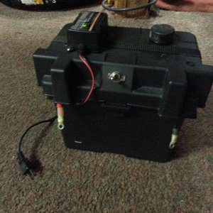 U1 size AGM with charger, 12v port, meter, and switched leads for alligator clamps.  We use this for charging RC gear.