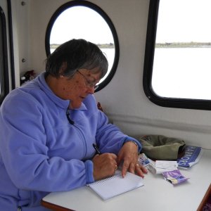 First Mate and CIC working on her log at the dinette table
