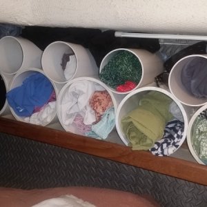 Media 'Closets; 4 and 6 inch pvc pipes on existing shelves in berth' in album 'His and hers slide outs in back of truck'