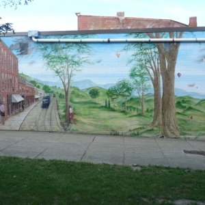 Media 'Many towns had murals.  This one in Lyons, NY.' in album 'Headed east, we spent our first night in a road side rest in Lolo Nat Forest.  We were greeted by the sun and a horse group setting out on a trail.  Good way to start a boat journey.'