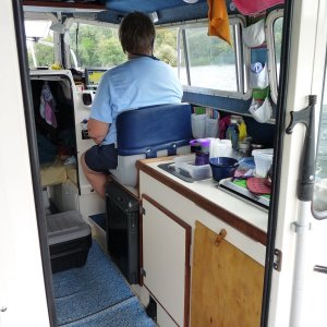 Two Bears in travel mode, Penny at helm.  Note that we have removed right hand cabnet door and replace with a 1/4 inch piece of plywood.  See next photo for the change to "living mode".