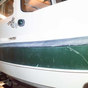 Scratches and an ugly rub rail