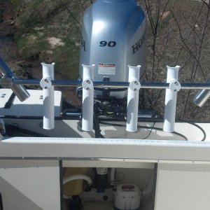 Mounted trolling rod holders and fish measure.