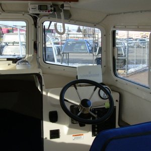 The electronics consist of a Lowrance LMS-520C Sonar/GPS Chartplotter Combo, and a Uniden Oceanus VHF. Dave Miller at Northwest Outlet didn't like the position of the "standard" wheel, and upgraded me to the tilt wheel option.