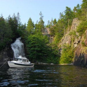 Anchored beneath the waterfall at Teakerne Arm