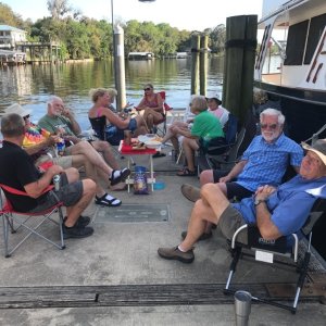 Socializing in the shade of a trawler at Welaka