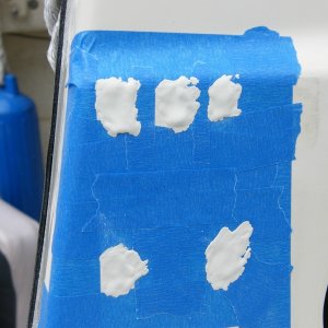 Media 'Starboard gelcoat was applied but did not fully fill the depressions. Cleaned with acetone and applied a second coat. After sanding level a few air bubbles showed so a third very light "wash" coat filled the bubbles and it ended up a perfect color match.' in album '11 transom screws or former screws sealed with adhesive sealant were removed, properly filled, and a gelcoat patch kit applied.  Color matching of the kit was definitely off.'