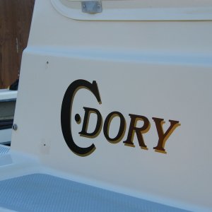 Media 'Starboard glasswork done and new decal' in album '11 transom screws or former screws sealed with adhesive sealant were removed, properly filled, and a gelcoat patch kit applied.  Color matching of the kit was definitely off.'