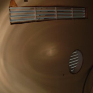 Vents located under the helm.  one is 15" by 2" the hole is 4" in diameter.  The top vent is located next to the compressor fan (exhaust side).