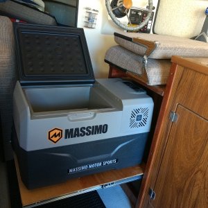 The fridge is 32 quart, 12v/AC LG compressor unit from Costco. I've been running it full of beer in one of the spare bedrooms for the past month and it seems to work really well. Supposedly 2.4 amp draw when running. Runs for about 5 minutes on a 25 minute cycle. I found out about them from the guys on the Expedition Portal forum. They seem to like them pretty well so we'll see how it goes. 

For $250 I figure it's definitely worth a shot compared to the price of some of the "name" brand units out there. If it sucks, back to Costco it goes.

I'll be adding a 150 watt solar panel to the roof rack to keep it chugging along.