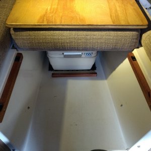 Used up some of the left over mahogany and birch ply from the fridge shelf project to fill in the opening at the front of the v-berth.

Velcro tabs used to keep it in place and to keep it from rattling.