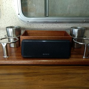 We were seriously lacking in the cup holder department so I made this little cup holder/storage-caddy thingy this week.