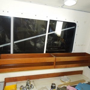 Media 'Two SEATEAK units end to end, came with the boat and were up in the V-birth.  Finished with Helmsman Spar Urethane.' in album 'Glued bracket onto wall, 5200 and hot glue'