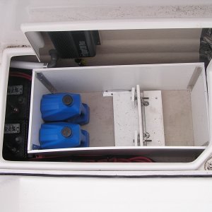 Added liner inside portside cock pit storage to protect wiring, etc. Shown is outboard motor mount for swim step