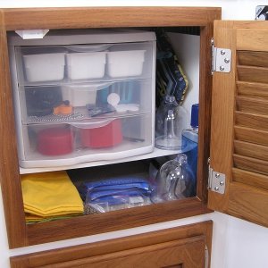 Storage under sink: added shelf and attached 3 drawer unit for untensils