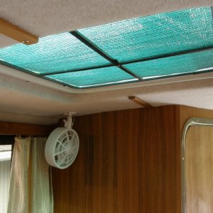Glued sun shade material to top of screens; removed light and added a fan