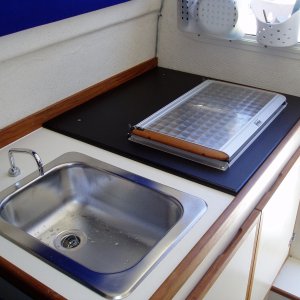 Replaced the "new" stove with the old.  New had smaller cutout but was placed way back on the counter.  They put a piece of starboard on that side of the counter and installed the old one!  Sportcraft Marina did a great job :)