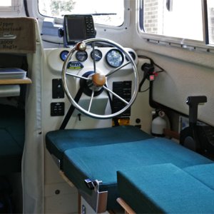 Media 'The helm seatback is quickly removed with a large knob on each side, I drilled out the aluminum rivets and used a tee nut (with brad holes) to accept the 5/16-18 bolt. The teenut is held in place with JB weld.' in album 'Port and Starboard Beds looking aft. The kitchen storage pocket is removed from the helm seat back and snapped to the cabin door when the starboard bed is setup.'