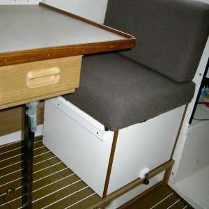 Media 'Dinette and seat in the standard forward position and locked in place. Also shows open storage for hose, electric cords, etc.' in album '533564-R1-10A.jpg'