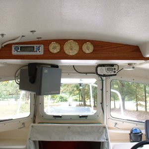 I closed in the shelf with oak and added the stereo and weather instruments. Will upgrade to a new DSC radio later and cut it in on the right side.
