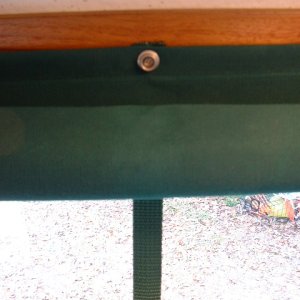 The snaps were installed on 3/4 inch nylon webbing that is sandwiched between the curtain and the teak. The snap stud is simply screwed through the curtain and webbing and  into the teak.
