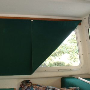 Curtains have a snap installed on the corner so we can get some ventilation and still have privacy...and keep the sun out.