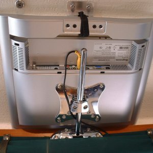 Bottom view of the mount. I through bolted it with stainless machine screws. The teak curtain board provides great support. I still have to find a longer power cord for the TV so all wires will be hidden, but it works ok for now.