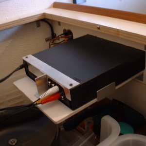 I built this bracket from 1/4" plywood and angle aluminum.  It is hooked into the aux jack of our stereo system. Great sound!