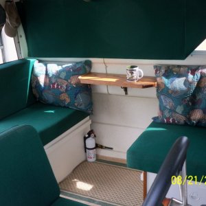 Made up a new table that better suits our regular use of the boat...fishing. We can reinstall the big table in 5 minutes if we want to reconfigure.
