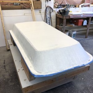 I decided that while I had the roof in the shop I would go ahead and prime it for painting later. I did final sanding with 320 grit sandpaper and then primed it with AlexSeal primer. The primer was thinned with the proper thinner and applied with the proper roller as per the AlexSeal directions. They claim that the roller texture would not show, but when I finished applying the primer, the rough roller texture was obvious. I was quite disappointed, but when I returned an hour later it had miraculously disappeared! Hurray! I am now optimistic and encouraged that the AlexSeal product will provide a good final paint finish for the boat exterior.
