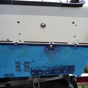 3. Number 10 screws drilled out with 3/8" drill bit, then additional yellow closed cell foam around the inside of the 3/8" hole removed with a "Dremel". 3/8" Swim step bolt holes redrilled out to 7/16".