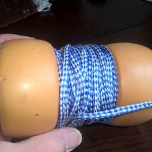 My anchor recovery system is two fishing floats making a spool with a piece of wood dowel.  50' of parachute chord.  It is too small to be mistaken for a mooring buoy, plus, I usually anchor in so shallow that other boats stay away.