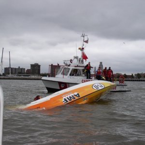 (Minnow) Oops! We had 2 medics on board with full gear, so we were the first to respond. After the pilots assured us they were OK, the divers on the rescue boat picked them up.