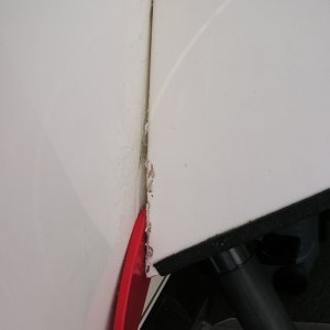 Pry tool inserted.