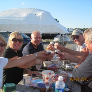 Mike Rizzo's Birthday and potluck diner at Shaws Boatyard in Dighton, Ma. as far up the up the Taunton River as we could go. Mike is at the end on the left. Toasting cupcakes what's up with that?