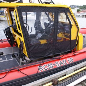 Media 'Southbound-DSC06577  Port McNeill - Rescue boat - It has quite the suspension system.  The volunteer claimed that on the military model, a sniper can sit on the roof and shoot while the boat does 30 knots through a chop.' in album 'Northbound-DSC06220 Sunrise leaving Hope Island moorage'