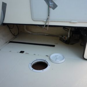 the second rubber strip the tank was sitting on had slid out a while ago reinstalled with contact cement. The front one (shown) stayed in place.