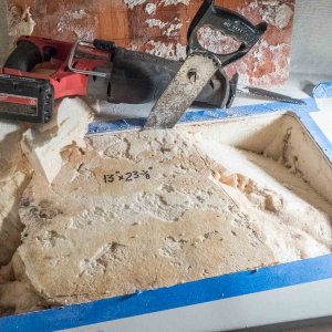 I used a hand saw to cut vertically around the hatch openings, then used a recipro saw to cut the interior mass of foam into sections for removal.