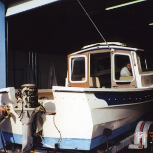 Media 'April 2000 - Checking out the motor.' in album 'March 2000 - Our 85 Angler'