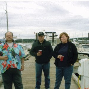 {R/J}: Rev. Jim with Harry & Patti Holman, christening of HOOKED II