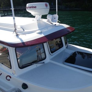 SleepyC external electronics array.  GPS down off the post and onto the brow, the hailer horn glued on, 2 VHF antennas work for 2 VHF's, with AIS receiver and AM/FM too. Forward hatch is up at first notch.  Gets lowered and locked down anytime I go out of Sequim Bay, or out into open water.