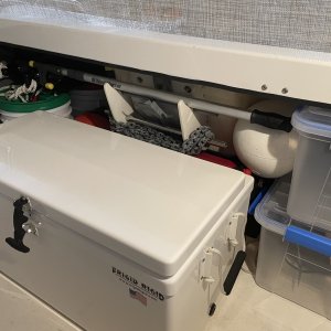 the whole thing goes behind the cooler tucked away but at the ready? makes a handy spot for the boat hook.