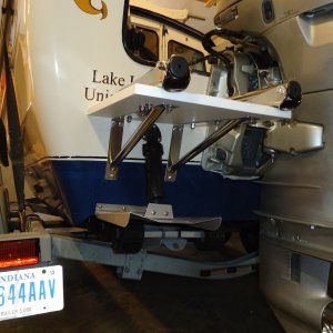 Off the shelf brackets and a piece of starboard.