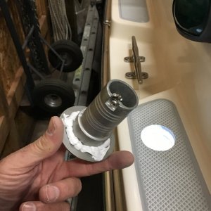 Installing water fill fitting.